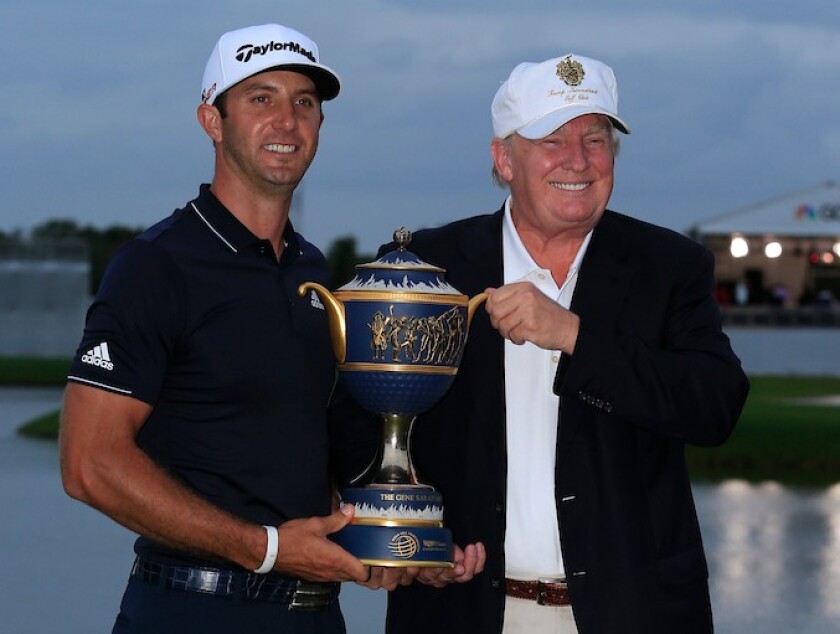 Donald Trump presents trophy to Dustin Johnson at 2015 WGC Cadillac Championship at Doral