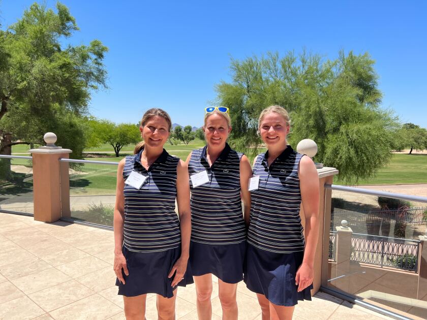 From left, Carla Janess, Courtney Trimble and Mara Janess prepare to welcome the event participants to Scottsdale, Arizona.