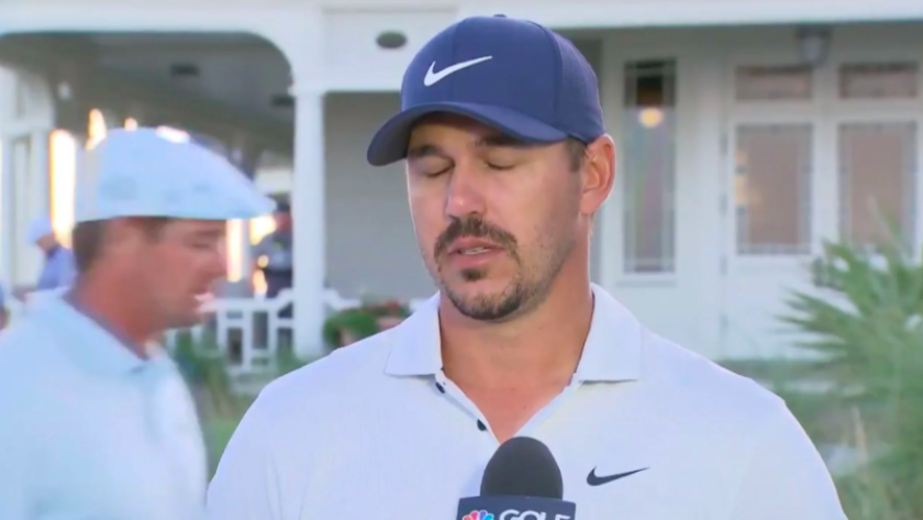 Brooks Koepka eyeroll as Bryson DeChambeau walks past at 2021 PGA Championship