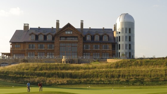 Lodge with golfers playing down below - Primland horizontal.jpg