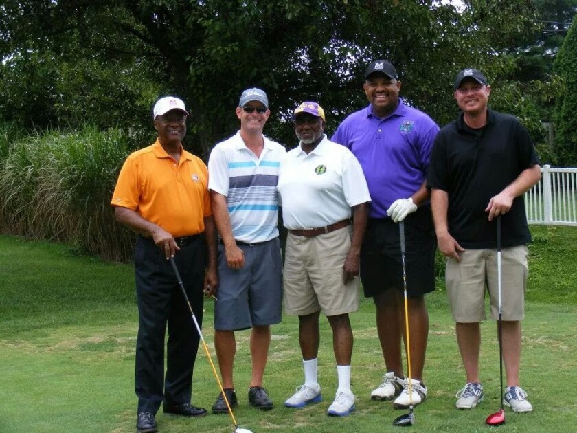 Earnie Ellison Jr. with golf group