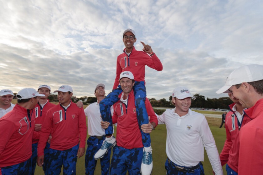 Akshay Bhatia, US Walker Cup Teammate, celebrates on the shoulders of Stewart Hagestad