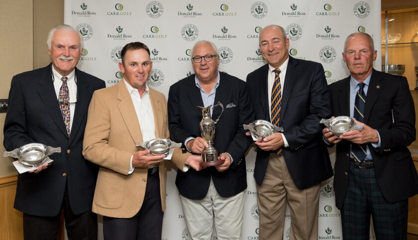 Team Guise presented with the 2019 Donald Ross Pro-Am trophies by Rob Stein, co-founder and president of Donald Ross Sportswear